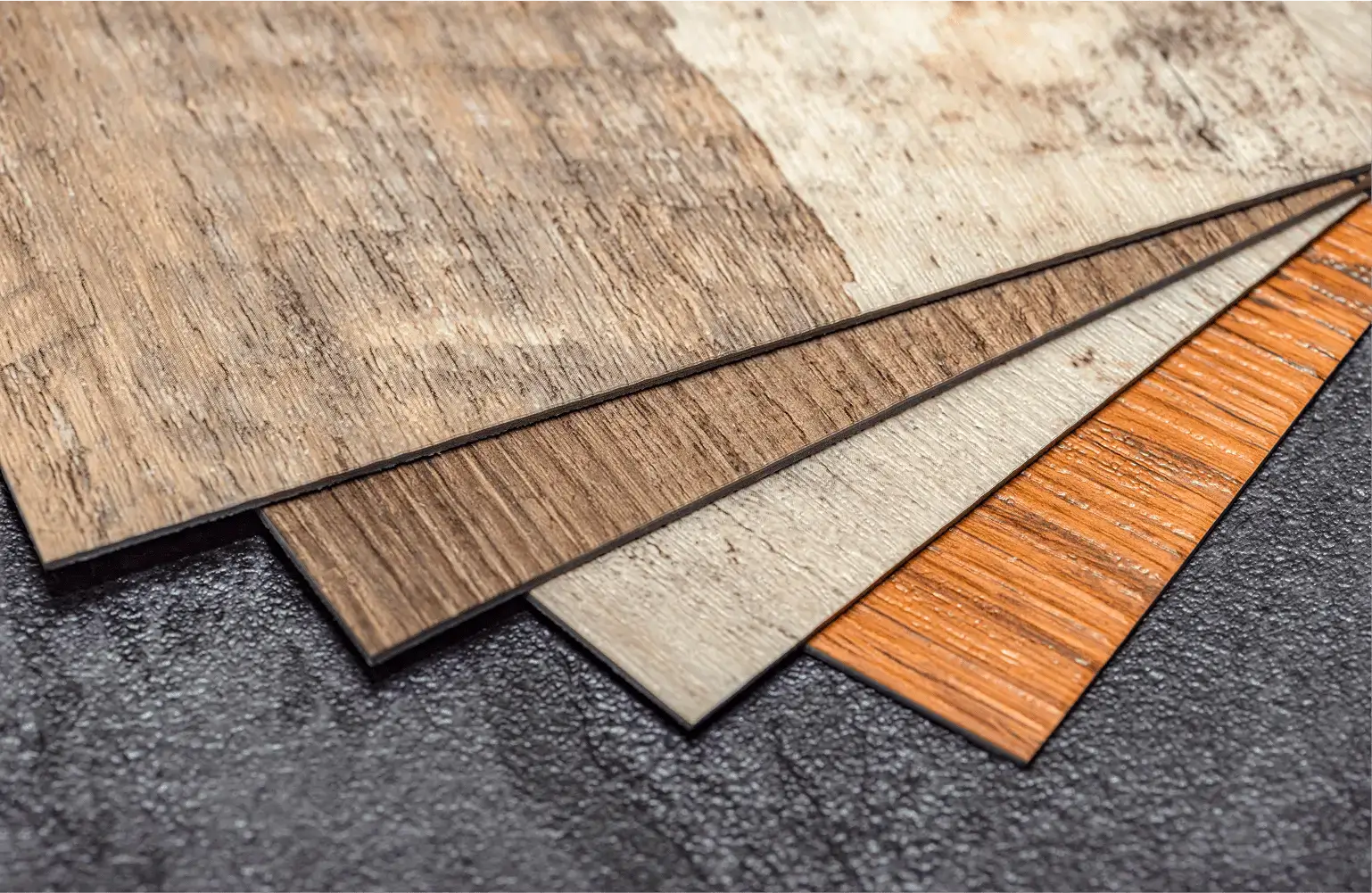 Wooden laminate flooring samples on display.